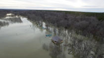 This drone photo provided by Hardin County Fire Department, Savannah, Tenn., shows flooding on Saturday, Feb. 15, 2020 in Savannah, Tenn. Days and days of heavy rain have created a dilemma for authorities managing dams along swollen rivers in Mississippi and Tennessee. (Melvin Martin /Hardin County Fire Department, Savannah, Tenn. via AP)