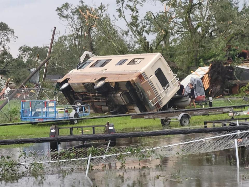 A mobile home is turned on its side off Main Street in Moss Point after a tornado struck the town Monday.
