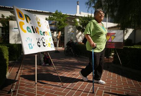 Vera Allen, 76, who has no health insurance, arrives at a Covered California event which mark the opening of the state's Affordable Healthcare Act, commonly known as Obamacare, health insurance marketplace in Los Angeles, California, October 1, 2013. REUTERS/Lucy Nicholson