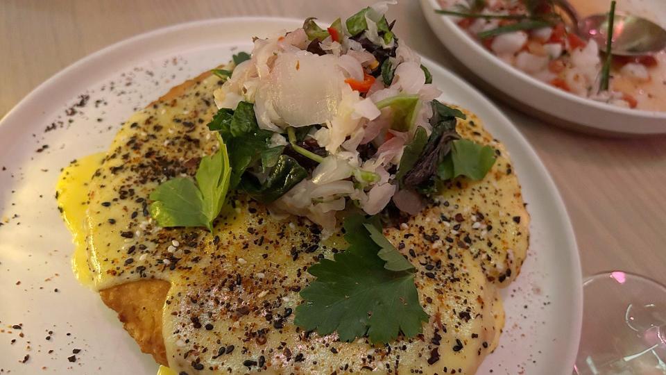 The Everything Sour Pancake at Mad Nice in Midtown Detroit is topped with pickled peppers and farm greens.