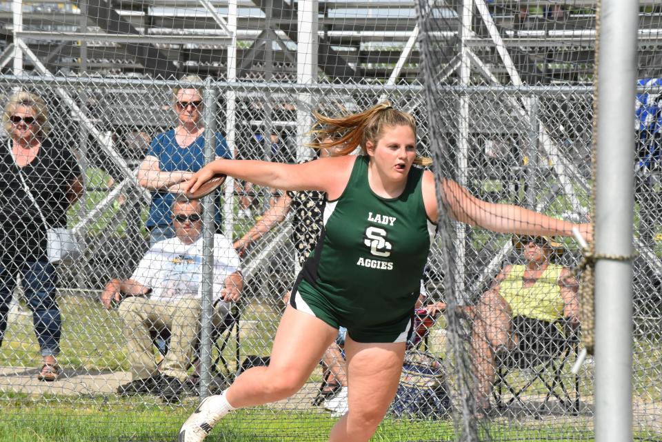 Sand Creek's Grace Elliott competes in the discus event at the Lenawee County Track and Field Championships at Onsted.