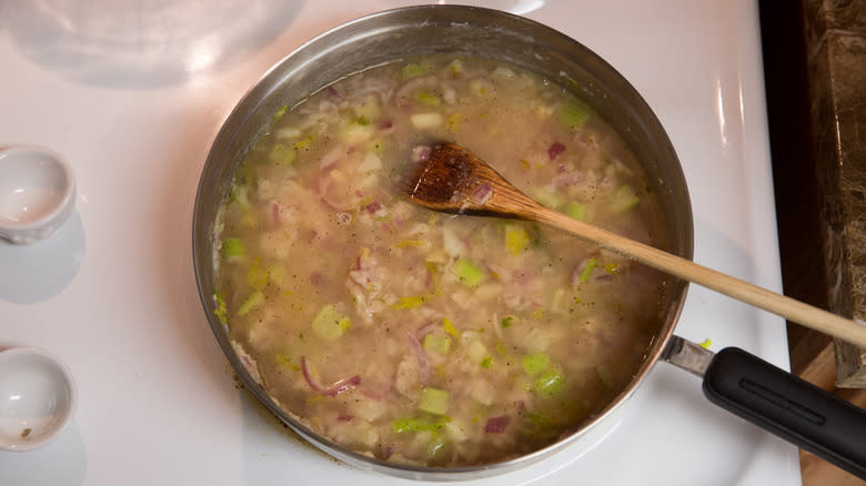 fish stock simmering in skillet