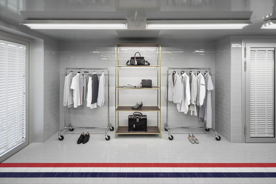 The brand’s signature red, white and blue stripe is a centerpiece of the space.