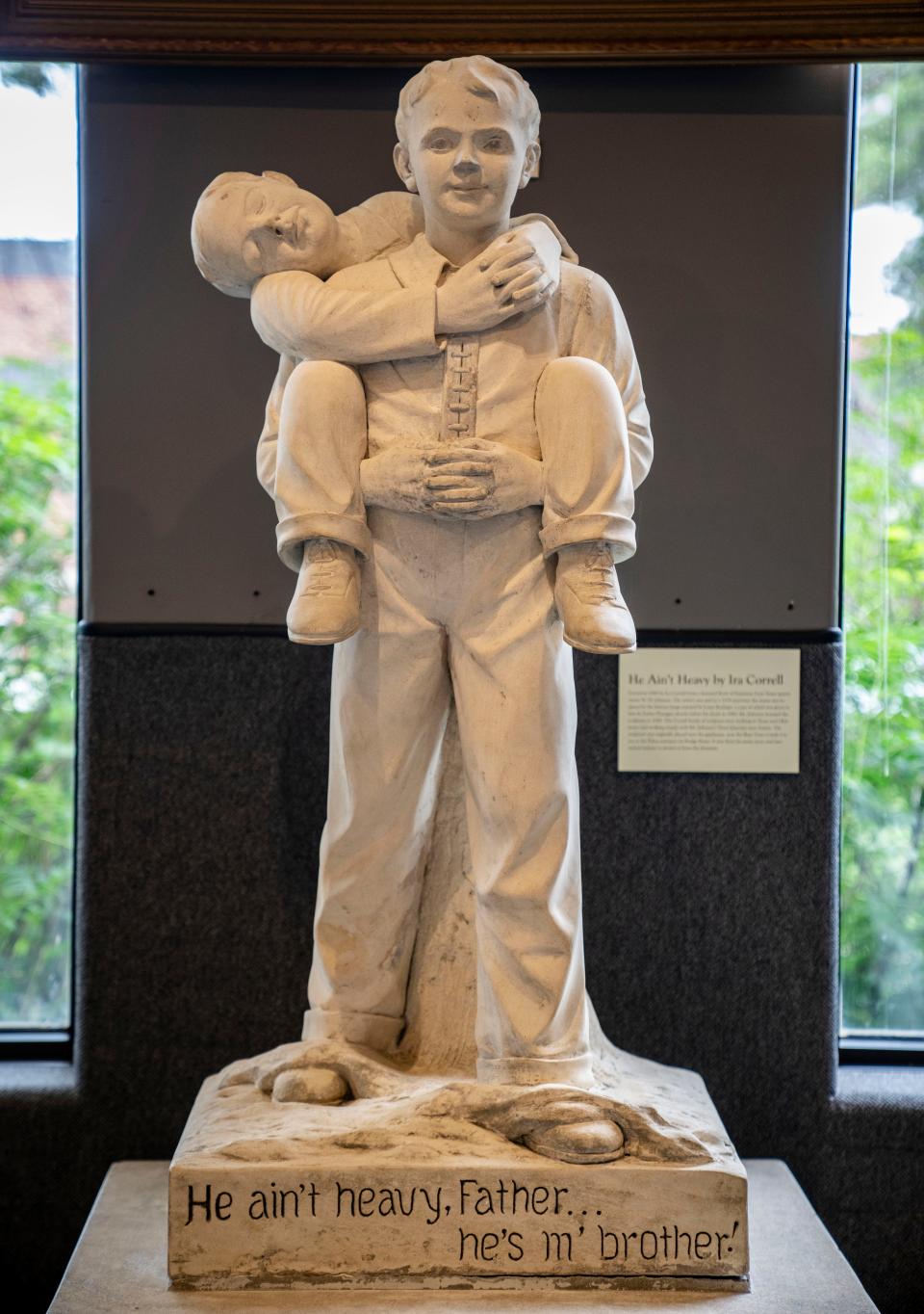 A statue engraved with "He ain't heavy, Father... he's m' brother" on display at the Boys Town Hall of History, Thursday, Aug. 3, 2023.