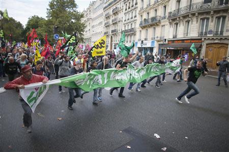 Protesters take part in a demonstration over pension reforms in Paris, September 10, 2013. REUTERS/Charles Platiau