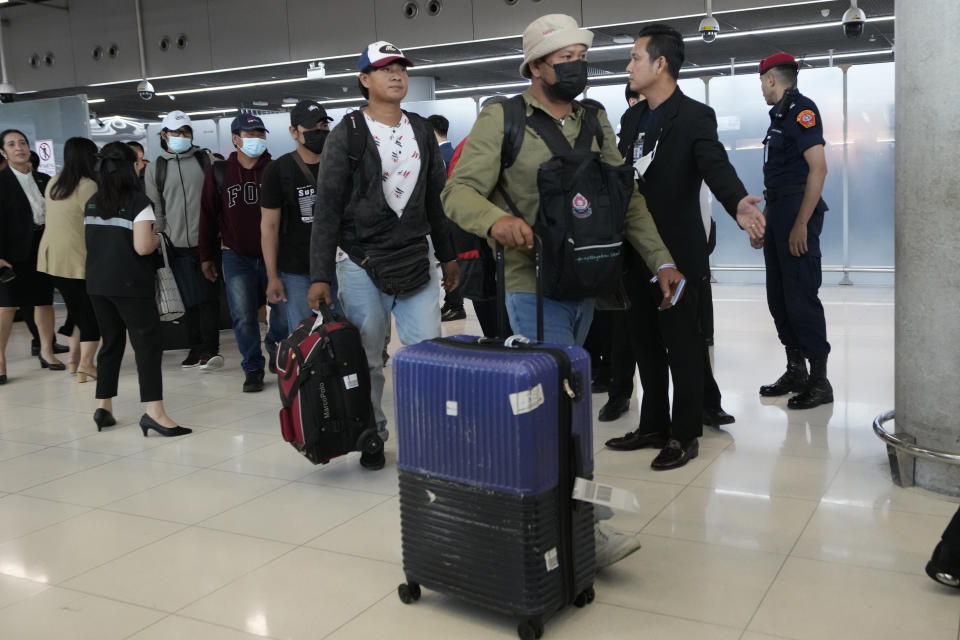 Thai workers who were evacuated from Israel, arrive at Suvarnabhumi International Airport, in Samut Prakarn Province, Thailand, Thursday, Oct. 12, 2023. The first Thai nationals evacuated since the latest war between Israel and Hamas returned home Thursday. (AP Photo/Sakchai Lalit)