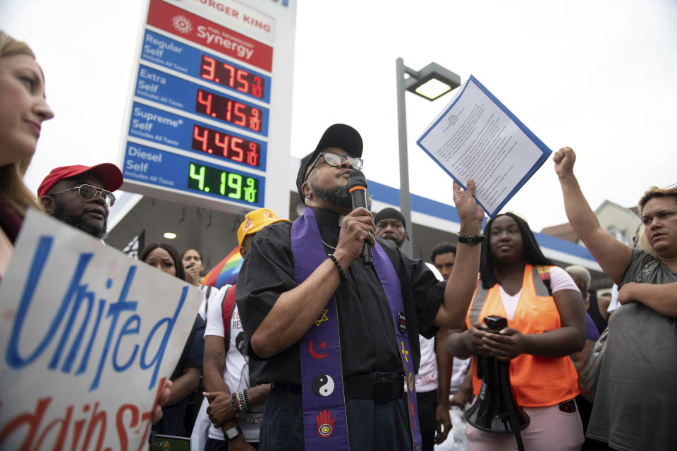 CORRECTS SECOND SENTENCE - Rev. Yunus Coldman speaks during a gathering to memorialize O'Shae Sibley on Friday, Aug. 4, 2023, in the Brooklyn borough of New York. Sibley, a gay man, was fatally stabbed at the gas station after a confrontation between a group of friends dancing to a Beyoncé song and several young men who taunted them. (AP Photo/Tracie Van Auken)