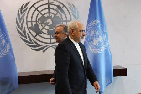 Iran's Foreign Minister Mohammad Javad Zarif walks past United Nations Secretary-General Antonio Guterres at the U.N. headquarters in New York City, U.S., July 17, 2017. REUTERS/Lucas Jackson