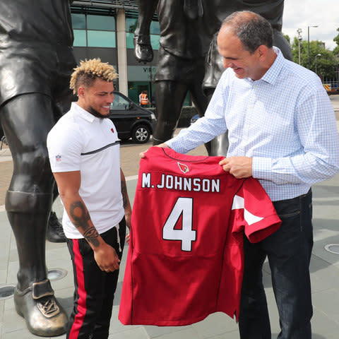 Tyrann Mathieu presents Johnson with an Arizona Cardinals jersey - Credit: SEAN RYAN/NFL