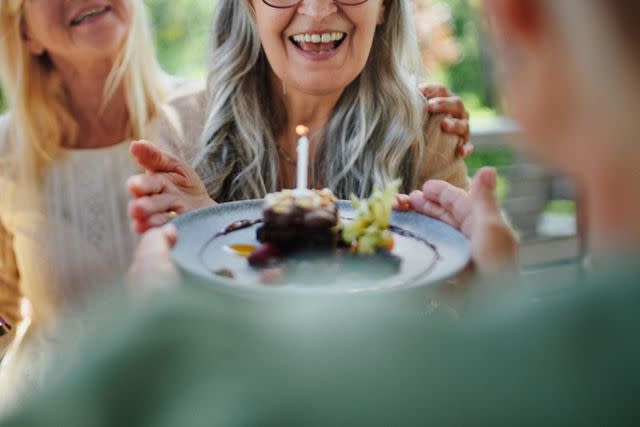 <p>Getty</p> Senior women friends having birthday party outdoors