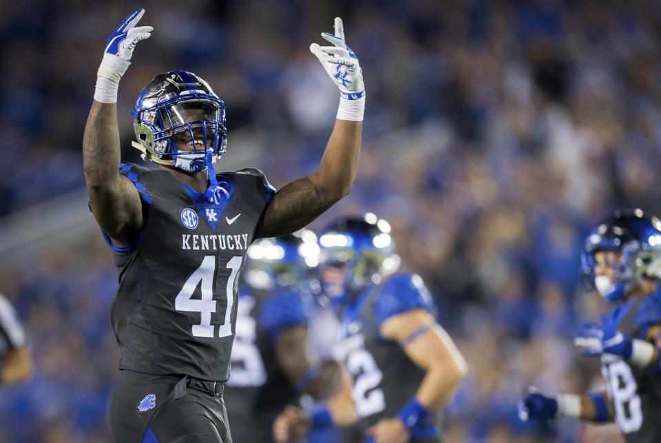 FILE - In this Sept. 29, 2018, file photo, Kentucky linebacker Josh Allen (41) rallies fans during the second half of the team's game against South Carolina, in Lexington, Ky. Allen was named to the 2018 AP All-America NCAA college football team, Monday, Dec. 10, 2018.(AP Photo/Bryan Woolston, File)