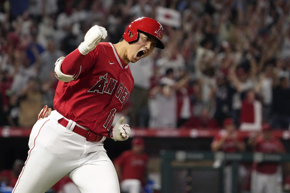 FILE - Los Angeles Angels' Shohei Ohtani celebrates as he rounds first after hitting a two-run home run during the seventh inning of a baseball game against the New York Yankees Monday, July 17, 2023, in Anaheim, Calif. Shohei Ohtani has been named The Associated Press' Male Athlete of the Year for the second time in three years. (AP Photo/Mark J. Terrill, File)