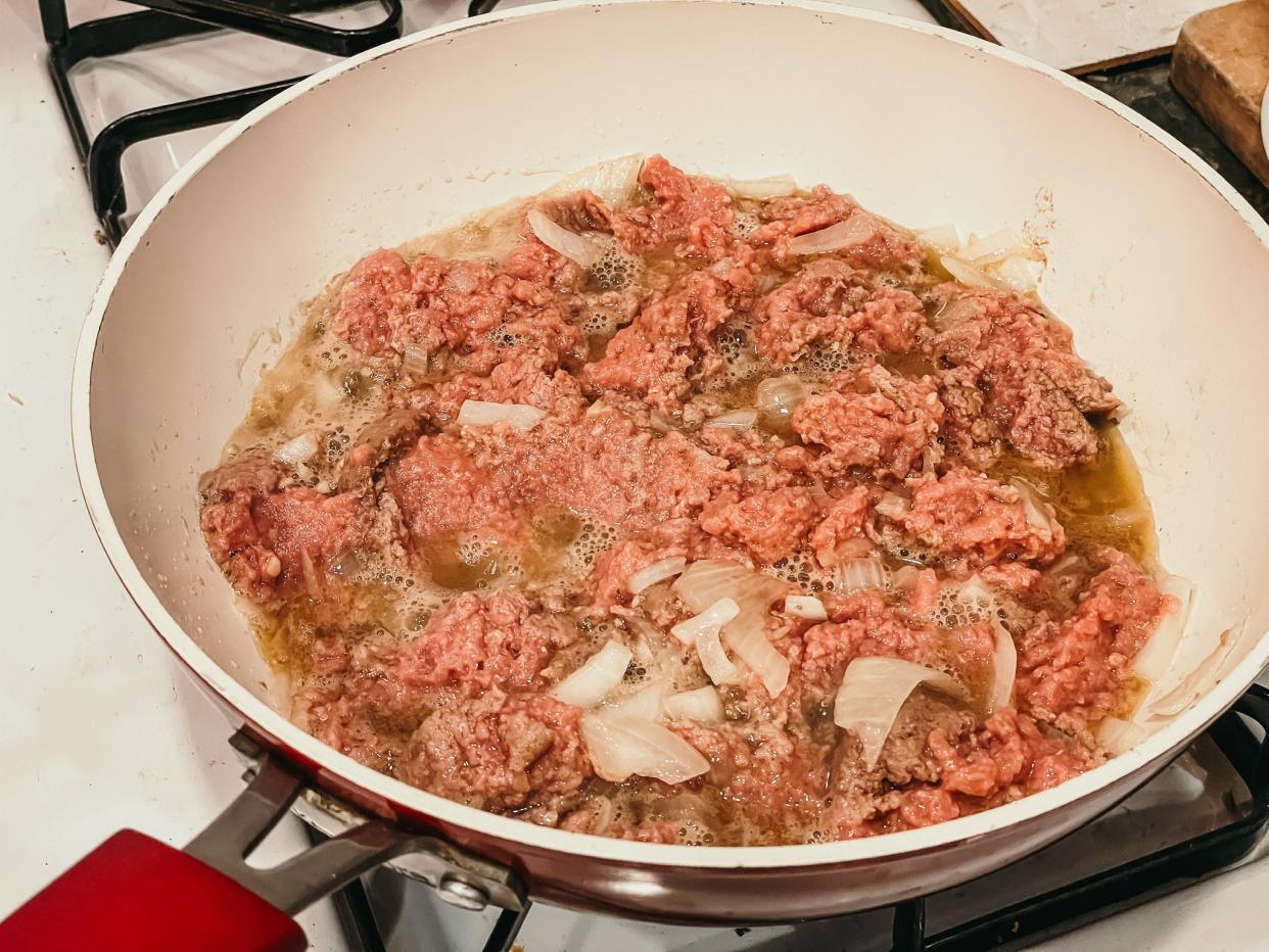 ground sausage in a pan with onions