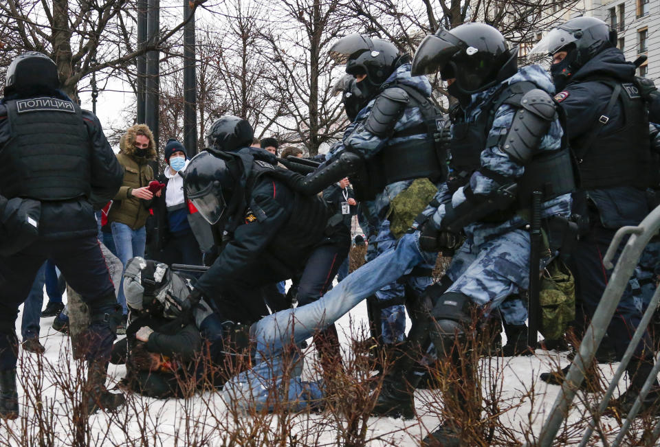 Police detain a man during a protest against the jailing of opposition leader Alexei Navalny in Moscow, Russia, Saturday, Jan. 23, 2021. Russian police on Saturday arrested hundreds of protesters who took to the streets in temperatures as low as minus-50 C (minus-58 F) to demand the release of Alexei Navalny, the country's top opposition figure. A Navalny, President Vladimir Putin's most prominent foe, was arrested on Jan. 17 when he returned to Moscow from Germany, where he had spent five months recovering from a severe nerve-agent poisoning that he blames on the Kremlin. (AP Photo/Alexander Zemlianichenko)