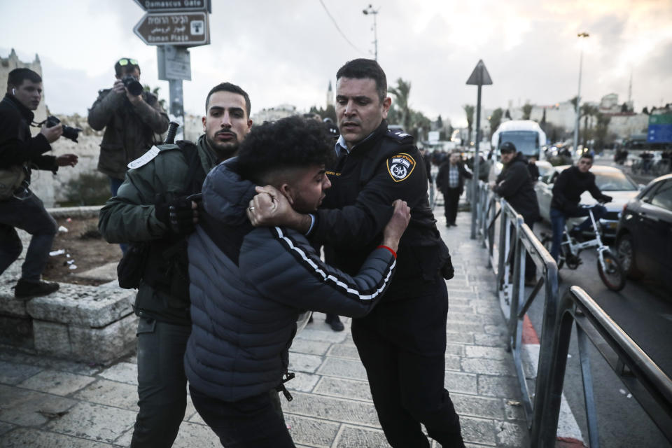 Israeli border police arrests a Palestinian ahead of a protest against Middle East peace plan announced Tuesday by US President Donald Trump, which strongly favors Israel, in Jerusalem, Wednesday, Jan 29, 2020. (AP Photo/Mahmoud Illean)