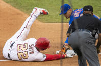 RETRANSMISSION TO CORRECT PLAY - New York Mets shortstop Andres Gimenez, back right, tags out Washington Nationals Juan Soto as Soto tried to advance on a single by Asdrubal Cabrera during the fourth inning of a baseball game in Washington, Wednesday, Aug. 5, 2020. (AP Photo/Manuel Balce Ceneta)