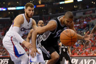 LOS ANGELES, CA - MAY 20: Tim Duncan #21 of the San Antonio Spurs and Blake Griffin #32 of the Los Angeles Clippers go after a loose ball in the first quarter in Game Four of the Western Conference Semifinals in the 2012 NBA Playoffs on May 20, 2011 at Staples Center in Los Angeles, California. NOTE TO USER: User expressly acknowledges and agrees that, by downloading and or using this photograph, User is consenting to the terms and conditions of the Getty Images License Agreement. (Photo by Harry How/Getty Images)