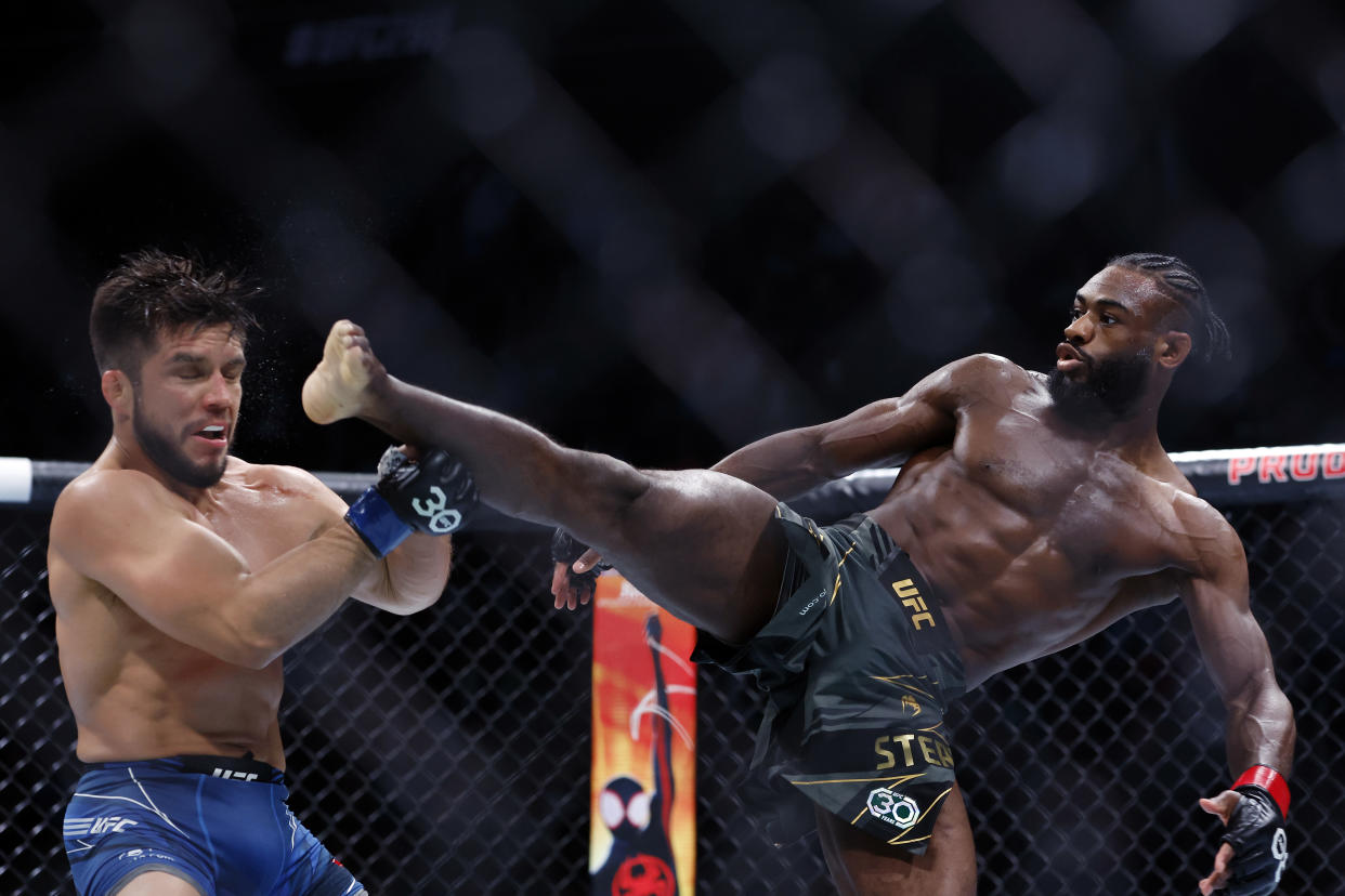 NEWARK, NEW JERSEY - MAY 06: Aljamain Sterling of Jamaica (green trunks) fights against Henry Cejudo (blue trunks) during their bantamweight title bout at UFC 288 at Prudential Center on May 06, 2023 in Newark, New Jersey. Sterling won by judge's decision. (Photo by Sarah Stier/Getty Images)