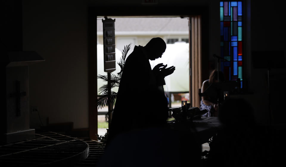 <p>Father Kris Bauta celebrates Mass at St. Joseph Catholic Church which was damaged from the effects of Hurricane Harvey, Sunday, Sept. 3, 2017, in Port Aransas, Texas. The church and Port Aransas is still with out electricity. (Photo: Eric Gay/AP) </p>