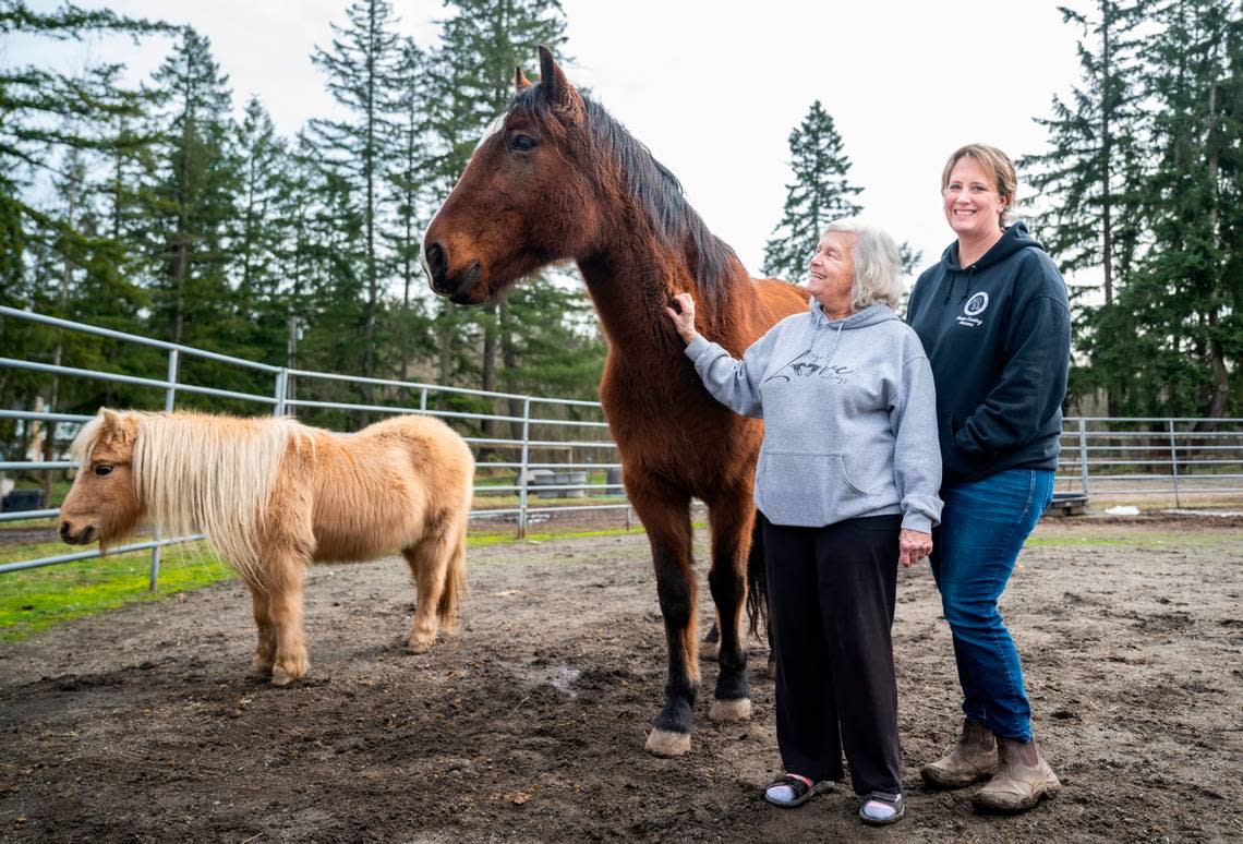 Sharon Lulham, left, and her daughter, Sholeh Lulham-New, right, co-owners of Four Star Farms. The nonprofit, Horses Guiding Humans, is operated there. It helps over 50 clients receive equine-assisted mental health therapy each week. Photographed in Graham on Jan. 31, 2023.