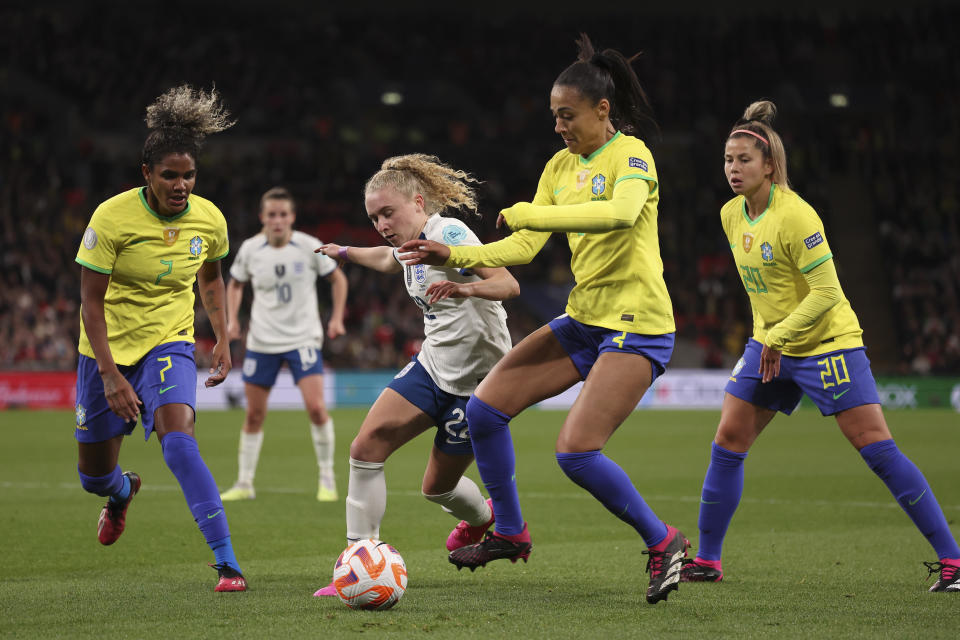 England's Katie Robinson is closed down by the Brazil defence during the Women's Finalissima soccer match between England and Brazil at Wembley stadium in London, Thursday, April 6, 2023. (AP Photo/Ian Walton)