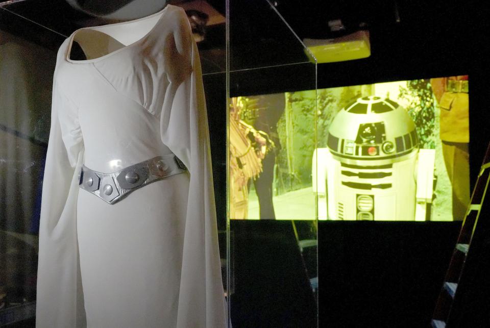 Princess Leia's ceremonial dress is displayed as part of the Reagan library's new "Star Wars and SDI" exhibit in Simi Valley on Wednesday. The exhibit, which runs Friday to Sept. 8, features items from the popular movie franchise and the Reagan administration's Strategic Defense Initiative, nicknamed "Star Wars."