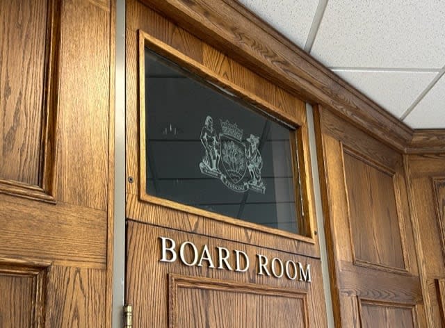 The window above a meeting room door at the Etobicoke Civic Centre is one of two places that staff have identified as locations that will soon lose the coat of arms.