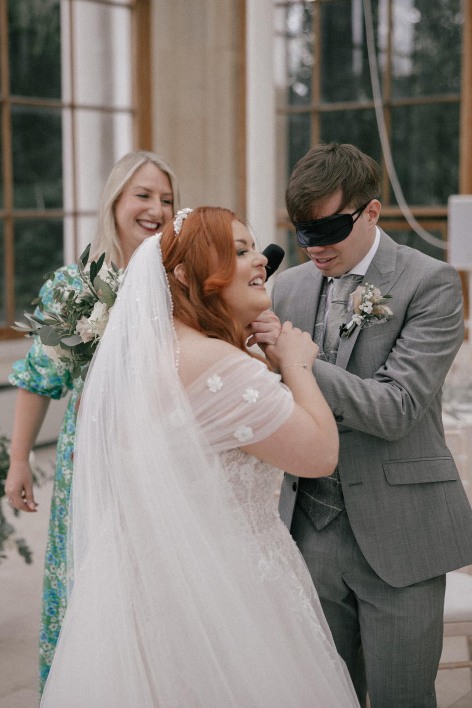 Cave felt his bride's dress before taking off his blindfold to see his soon-to-be wife. (eternal-imaging/Philip White Wed/SWNS)
