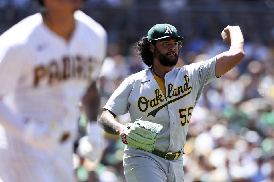 Oakland Athletics starting pitcher Sean Manaea throws out San Diego Padres' Manny Machado at first base in the fourth inning of a baseball game Wednesday, July 28, 2021, in San Diego. (AP Photo/Derrick Tuskan)