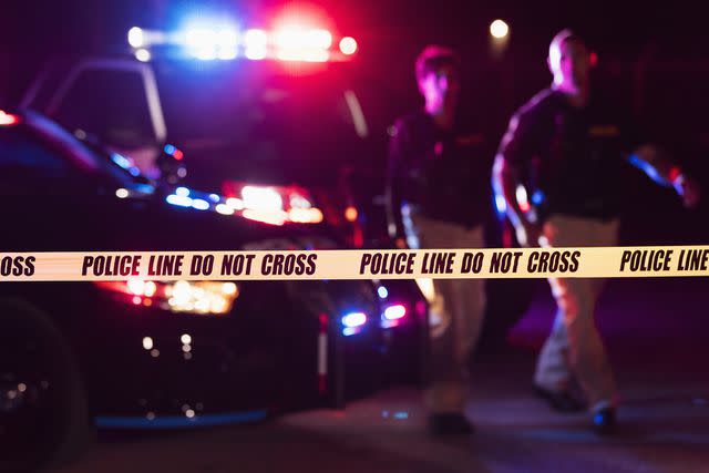 <p>Getty</p> Police tape night time stock image