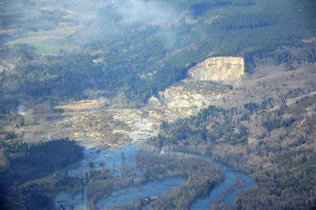 An aerial view shows the damming of the Stillaguamish River after Saturday's landslide in Oso, Washington, is seen in this Washington State Department of Transportation photo taken March 23, 2014. REUTERS/Washington State Department of Transportation/Handout