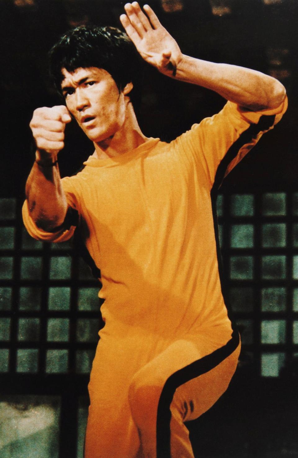 Bruce Lee sporting a yellow jumpsuit – later emulated in Quentin Tarantino’s ‘Kill Bill’ – in the ultimately unfinished film ‘Game of Death’ (Shutterstock)