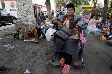 Irma Viviana Reyes from Guatemala looks on after arriving with fellow Central American migrants, who are moving in a caravan through Mexico toward the U.S. border, in Puebla, Mexico April 6, 2018. REUTERS/Henry Romero