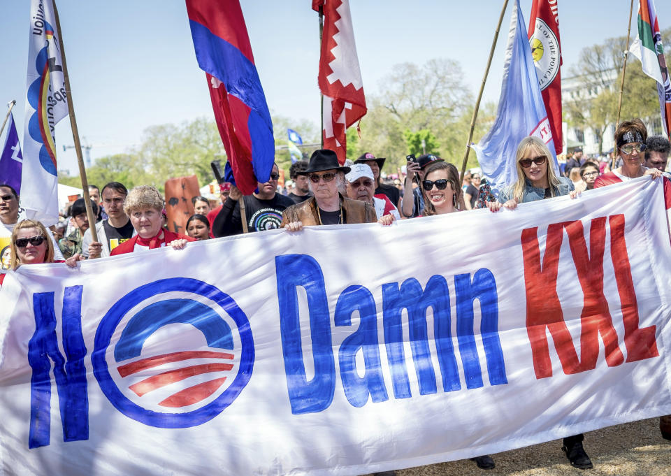 The Cowboy and Indian Alliance — including rock icon Neil Young and actress and environmentalist Daryl Hannah, second from right — march in Washington, D.C., on Saturday, April 26, 2014. (Photo: Pete Marovich/Boomberg)