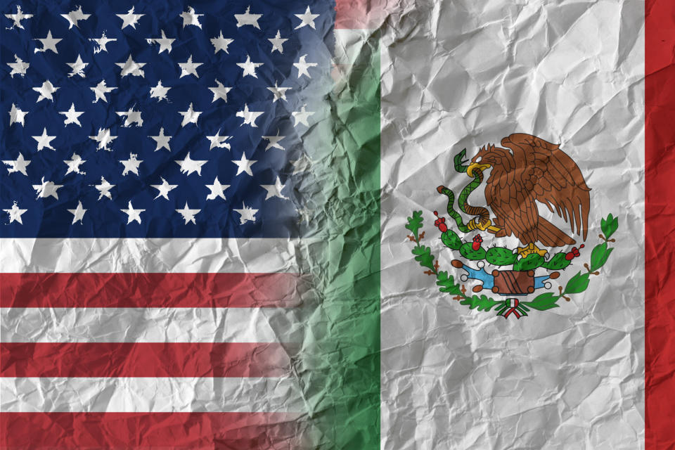 US and Mexico on crumpled paper, policy and relations concept