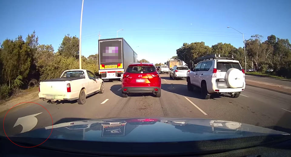 Some people thought the truck missed the 'left lane must turn left' sign on the road (circled).