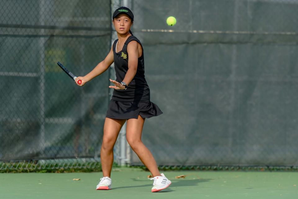 Rock Bridge's Maggie Lin lines up to return the ball during a match against Jefferson City in the Class 3 District 4 team finals at Cosmo-Bethel Park.