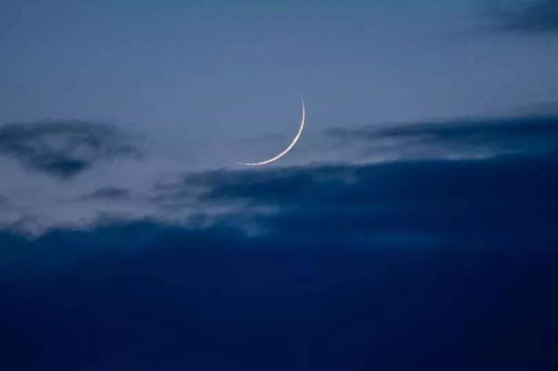 The first slim crescent of the new moon that determines Dhul Hijjah and Eid ul Adha 2024 seen over Derby
