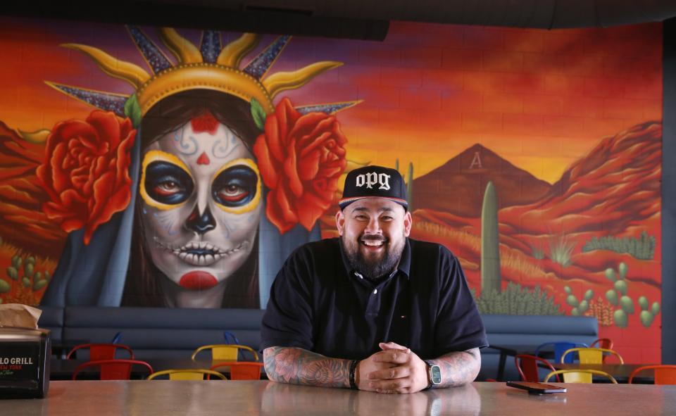 Joe Zolnierowski, chef and owner, sits at the bar at the new location of Old Pueblo Grill in Victor.