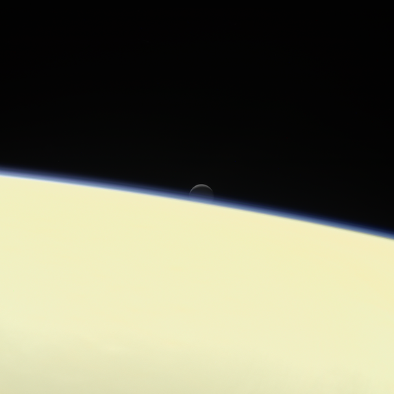 In 2017, the Cassini spacecraft caught an image of Enceladus setting behind Saturn.