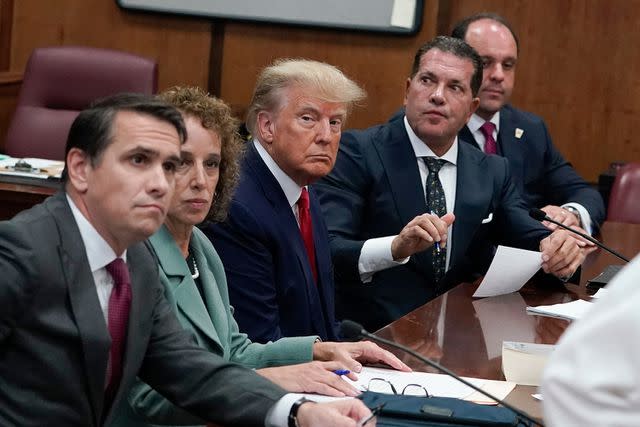 SETH WENIG/POOL/AFP via Getty Donald Trump and his legal team appear in court on April 4, 2023, to answer to 34 felony charges brought by the Manhattan DA's office