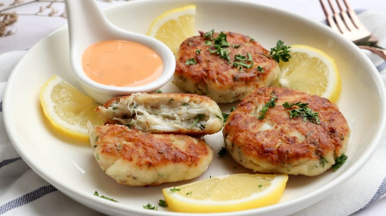 Crab cakes plated with remoulade sauce