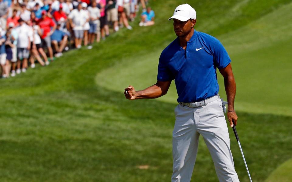 Tiger Woods starts Sunday’s final round at Bellerive just four strokes off the lead. (AP Photo)