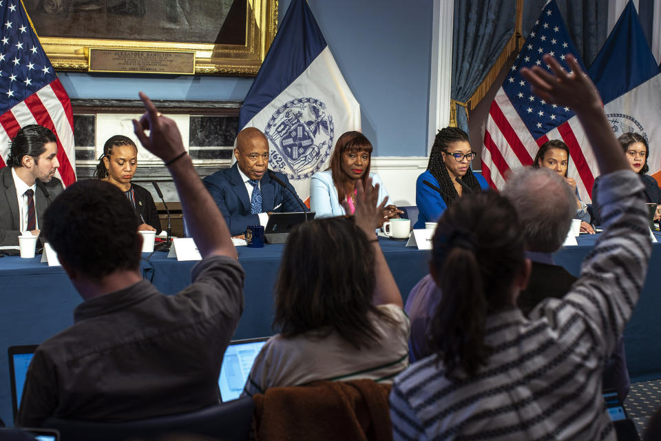 New York City Mayor Eric Adams, third left, listens to questions from the media during a news conference at City Hall in New York, Tuesday, March 19, 2024. (AP Photo/Eduardo Munoz Alvarez)