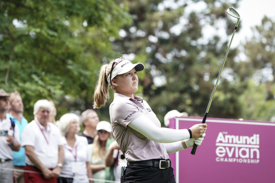 CORRECTS NATIONALITY - Brooke Henderson, of Canada, follows her ball after playing on the 2nd hole during the Evian Championship women's golf tournament in Evian, eastern France, Saturday, July 23, 2022. (AP Photo/Laurent Cipriani)