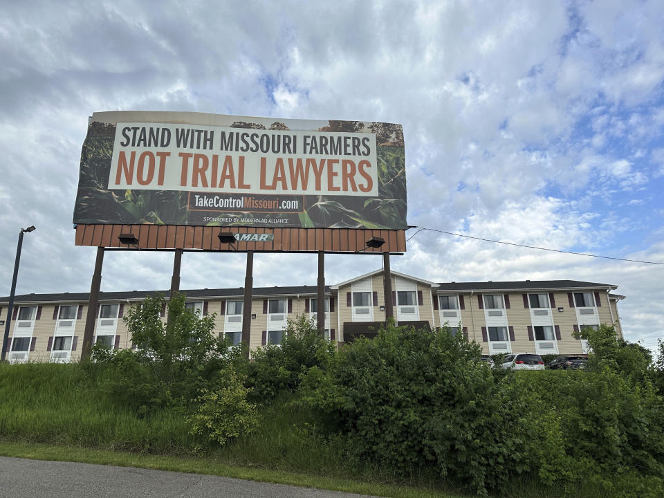 A billboard supporting legislation that would provide legal protection to manufacturers of pesticides such as Bayer's popular weedkiller Roundup, is shown in Jefferson City, Mo., on May 13, 2024. (AP Photo/David A. Lieb)