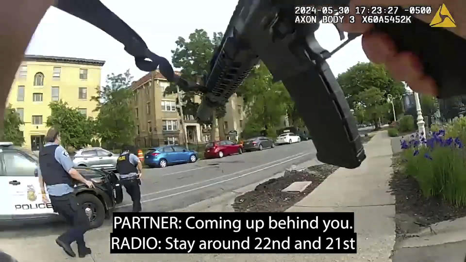 Frames from body-camera video released show officers responding to a shooting in which Minneapolis Police Officer Jamal Mitchell was killed along with three others, including the gunman, May 30, 2024, in Minneapolis, Minn. (Minneapolis Police Department via AP)