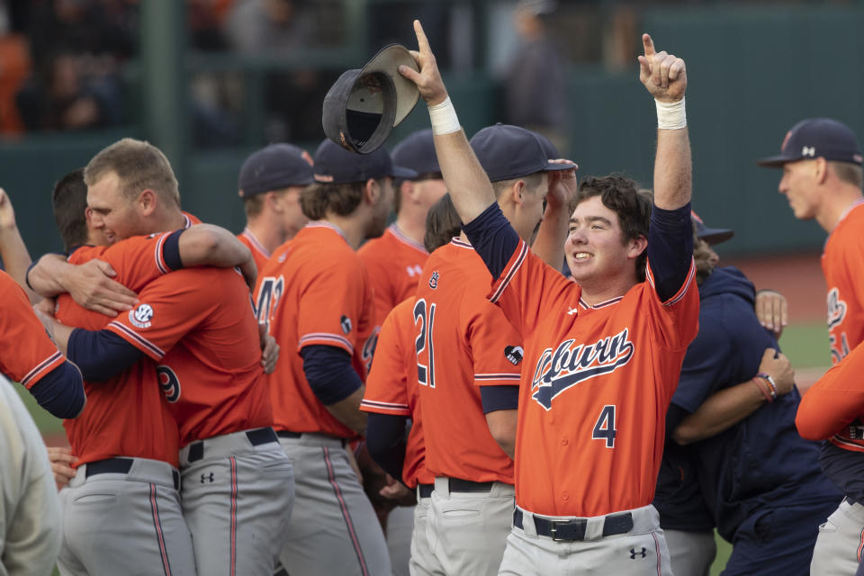 Auburn infielder Brody Moore (4) celebrates his team's win over Oregon State in an NCAA college baseball tournament super regional game on Monday, June 13, 2022, in Corvallis, Ore. (AP Photo/Amanda Loman)