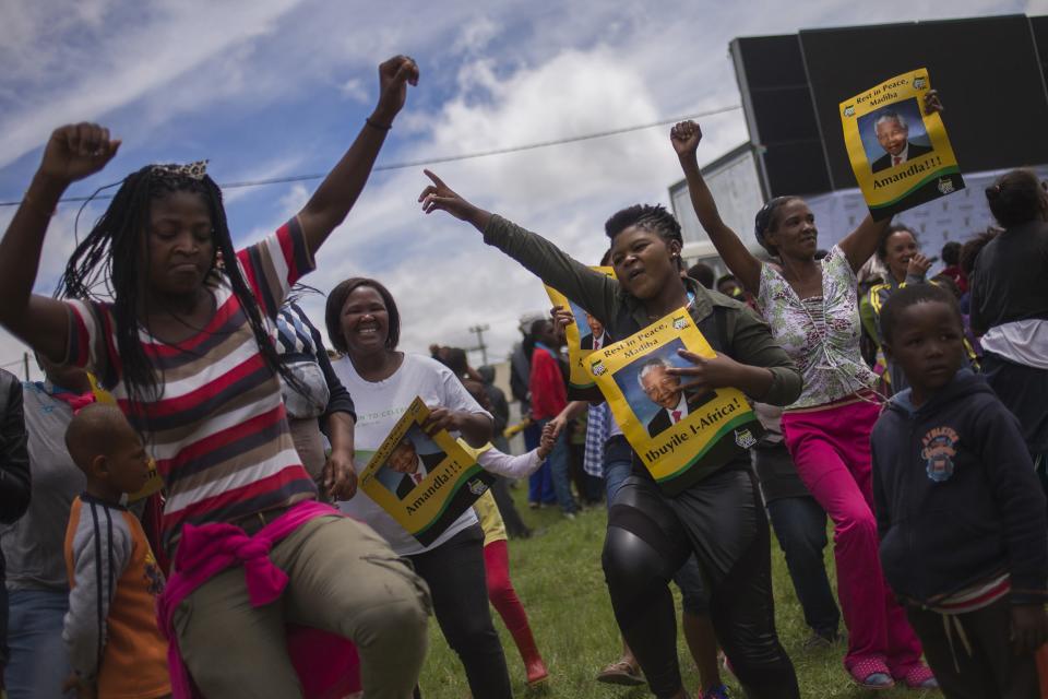 Women dance during a memorial service for late former South African President Nelson Mandela, organized by the African National Congress (ANC), in Old Payne located between the towns of Mthatha and Qunu, South Africa