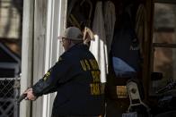 An officer from the U.S. Marshals fugitive task force hunts for accused bank robber Wossen Assaye, who escaped Inova Fairfax Hospital early Tuesday in Fairfax, Virginia March 31, 2015. The armed prisoner was on the run in a stolen car on Tuesday after escaping from the northern Virginia hospital where a shot was fired during a struggle with a guard, police said. Assaye, 42, broke free from a private security guard at the Inova Fairfax Medical Campus in Falls Church, Virginia, and fled with the guard's weapon, the Fairfax County Police Department said on its Twitter account. (REUTERS/James Lawler Duggan)